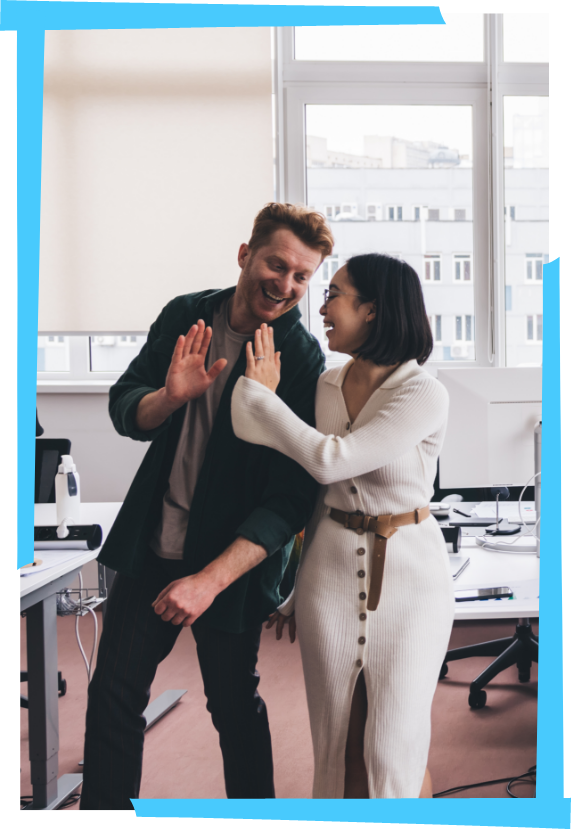 EOR1 2 people high-fiving in an office